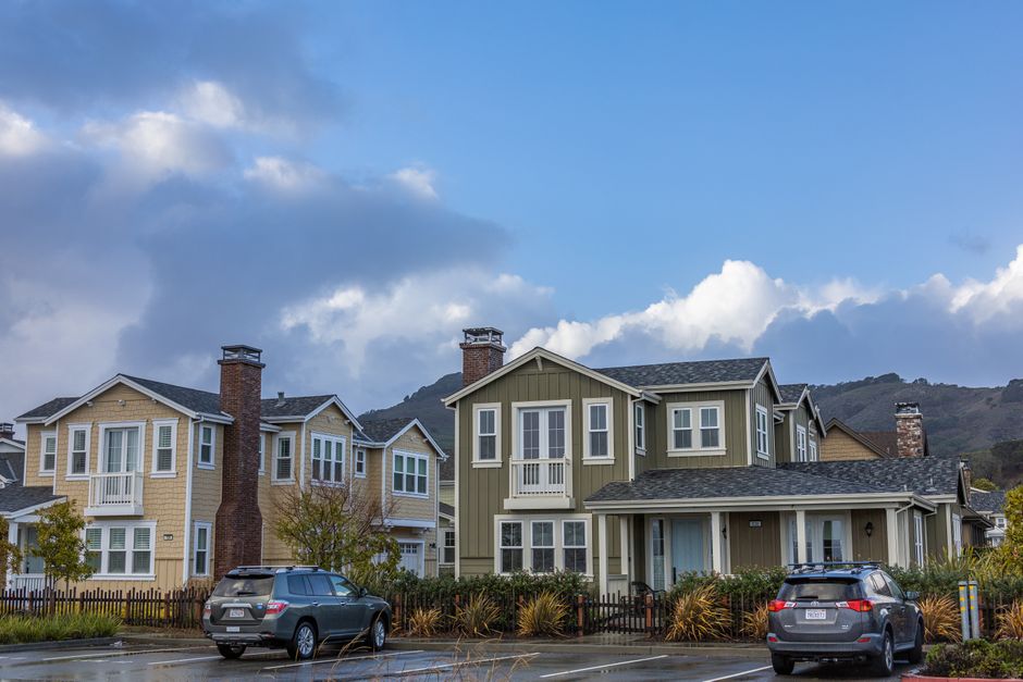 Detached single-family homes on a flat suburban street