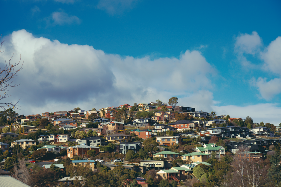 Homes stepped up a hillside on sloped lots